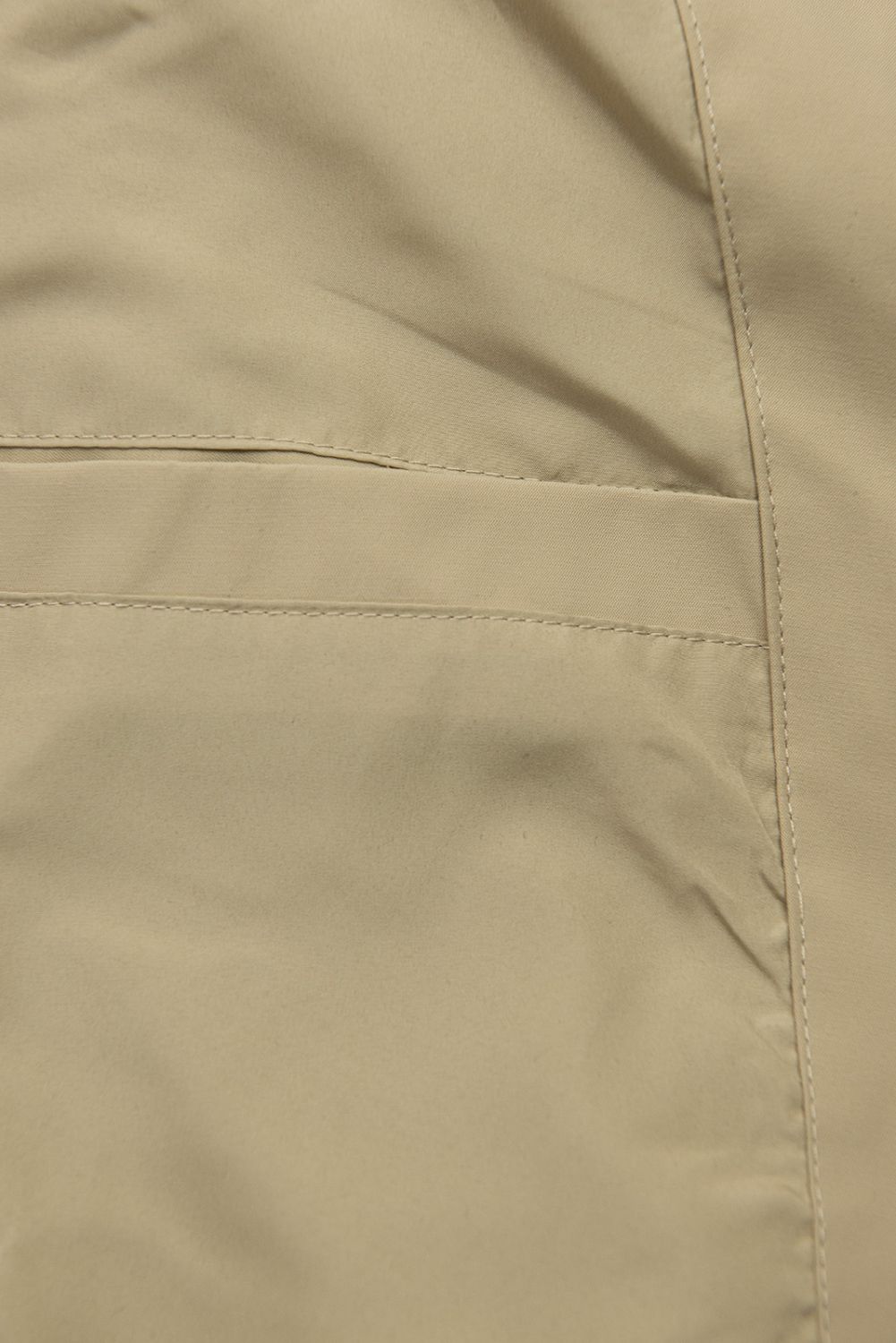 Podaljšana parka s potiskom v kapuci bež