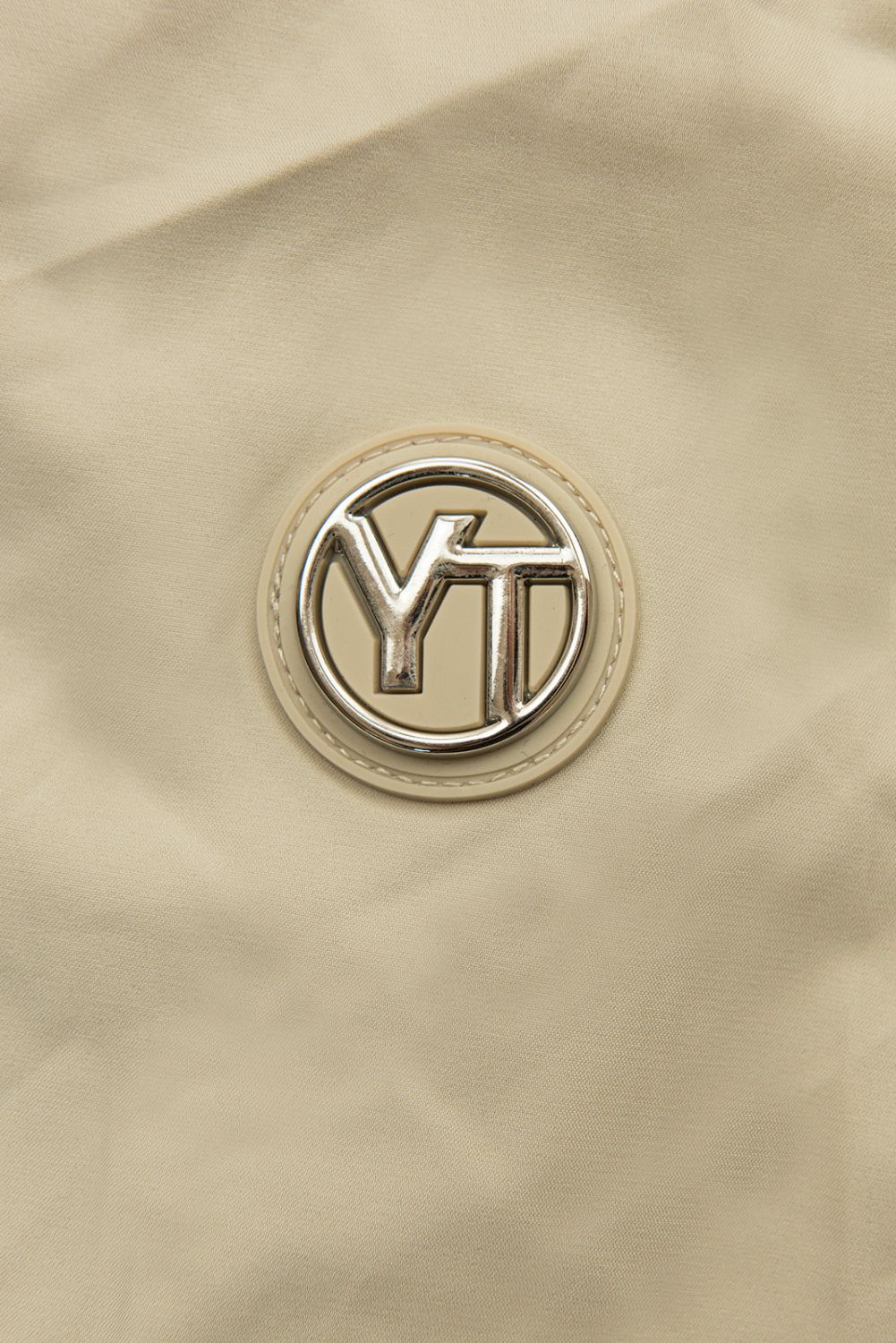 Spomladanska parka z veliko kapuco bež