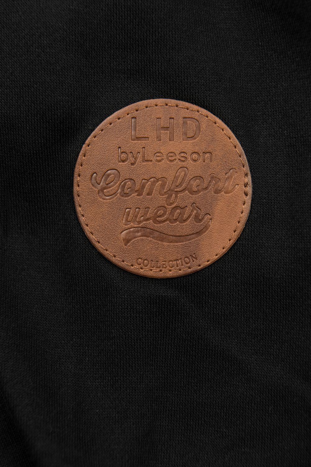 Črna daljša jopica na zadrgo