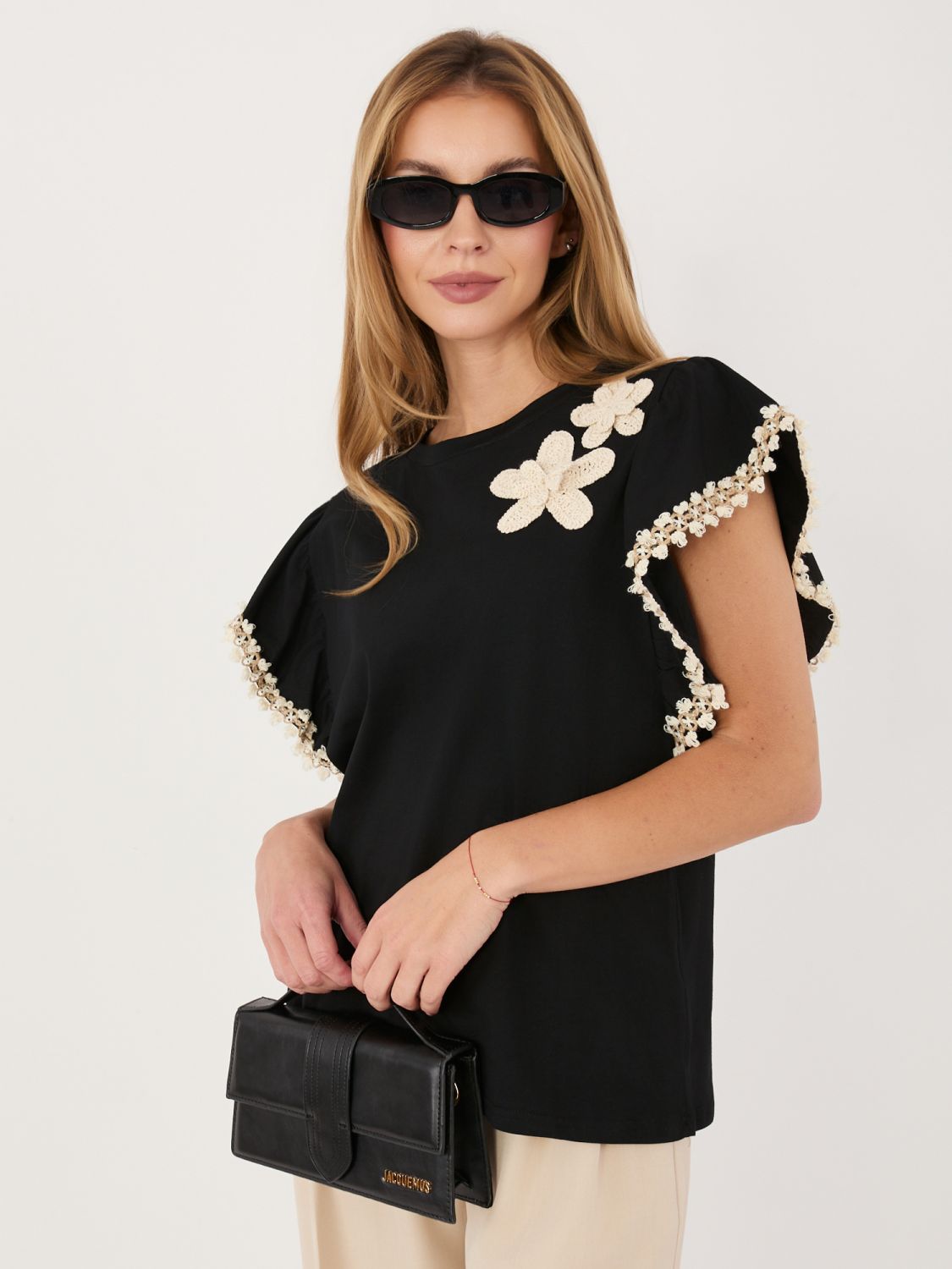 Črna bombažna bluza z aplikacijo