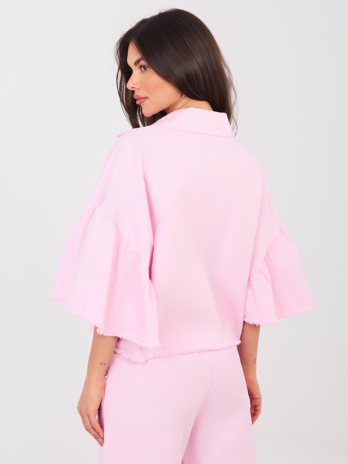 Kratka roza jeans jakna z volanom