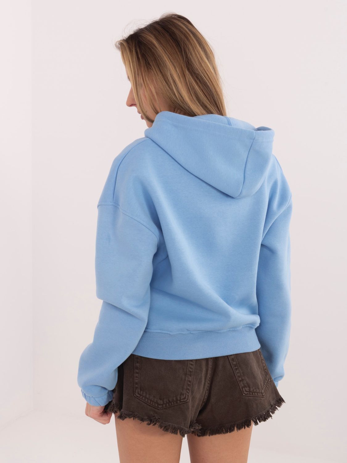 Kratka modra jopa s kapuco in zadrgo