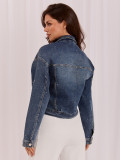 Temno modra jeans jakna z aplikacijo