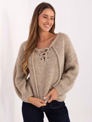 Bež pulover s pletenim vzorcem in vezalkami pri izrezu